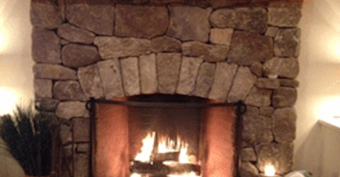 Lit Stone Fireplace